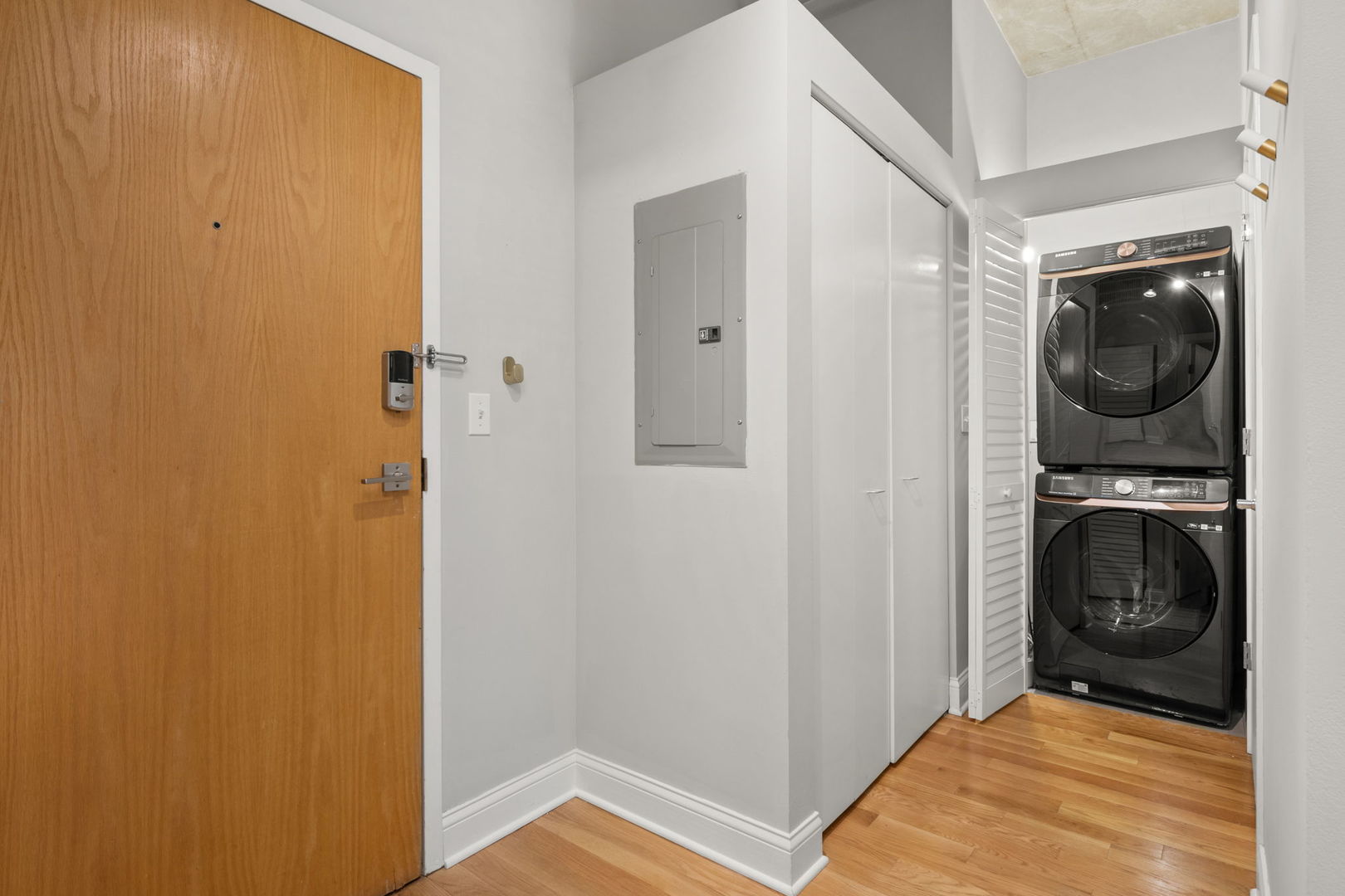 933 West Van Buren Street, Unit 508 Chicago, IL 60607 - Photo 8 of 25 a view of a hallway with washer and dryer