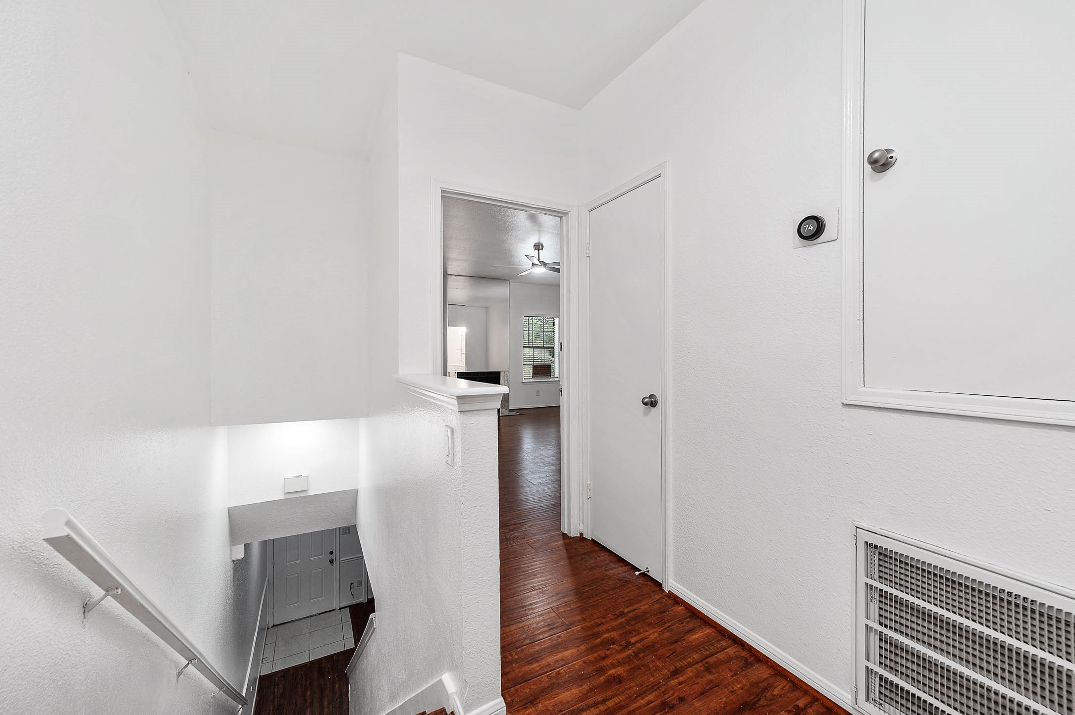 6000 Reims Road, Unit 2003 Houston, TX 77036 - Photo 12 of 24 a view of a hallway with wooden floor