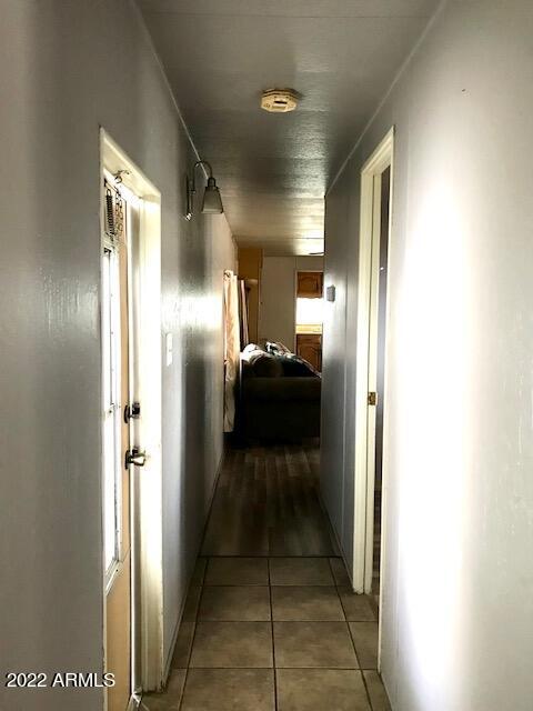 5201 West Camelback Road, Unit F207 Phoenix, AZ 85031 - Photo 13 of 17 HALLWAY FROM BEDROOMS TO LIVING AREA F20