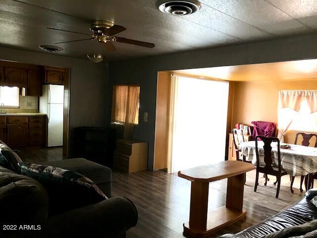 5201 West Camelback Road, Unit F207 Phoenix, AZ 85031 - Photo 3 of 17 LIVING AREA TO ARCADIA DOOR EXIT F207