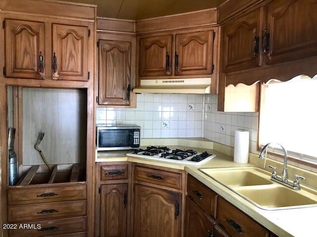 5201 West Camelback Road, Unit F207 Phoenix, AZ 85031 - Photo 6 of 17 KITCHEN OVEN AREA AND COOK TOP F207