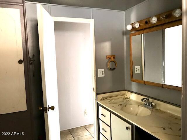 5201 West Camelback Road, Unit F207 Phoenix, AZ 85031 - Photo 10 of 17 BATHROOM VANITY AND LIGHTING F207