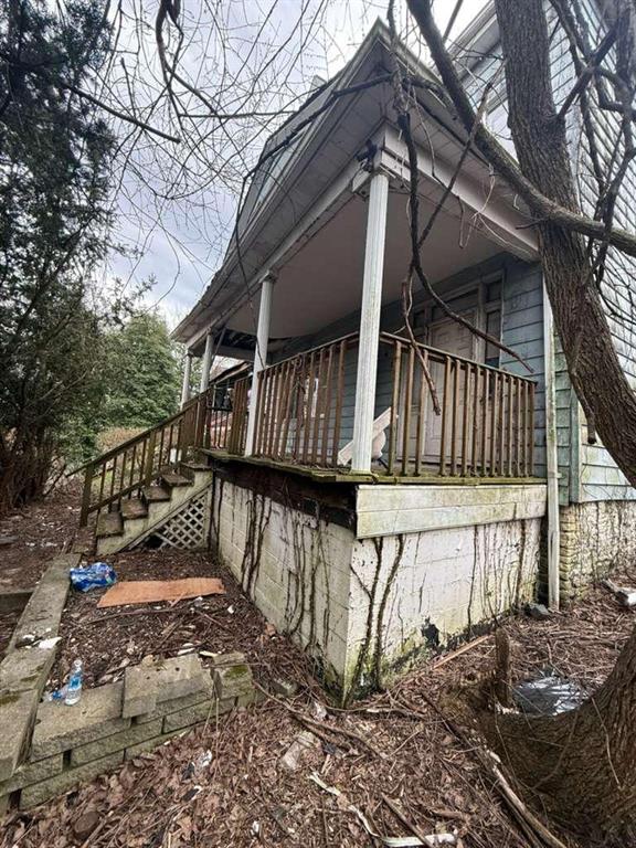 419 Prospect Avenue Donora, PA 15033 - Photo 1 of 17 a view of wooden house with a bench next to a yard