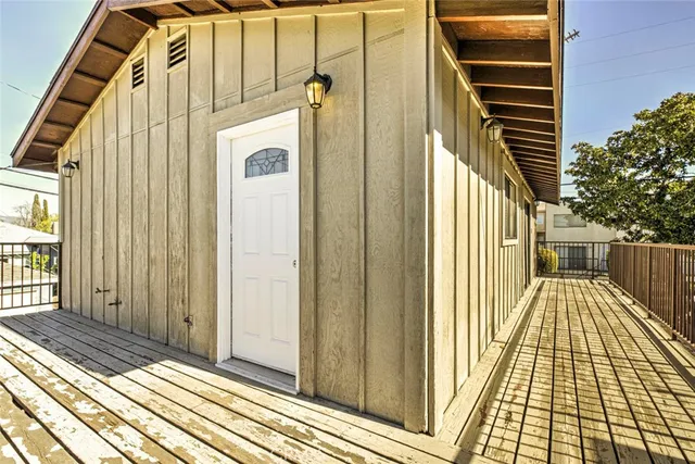 a view of a balcony with wooden floor