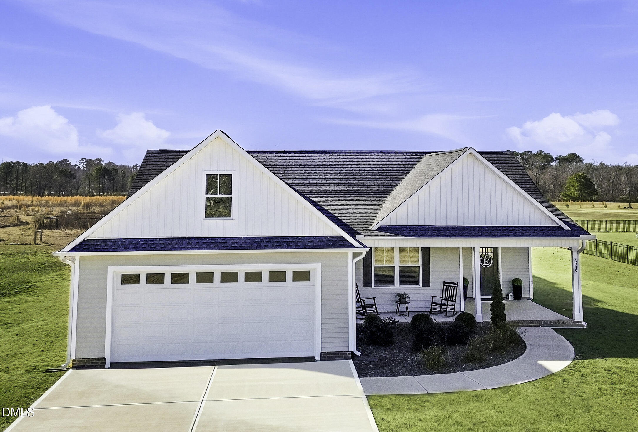 a front view of house with yard outdoor seating and barbeque oven