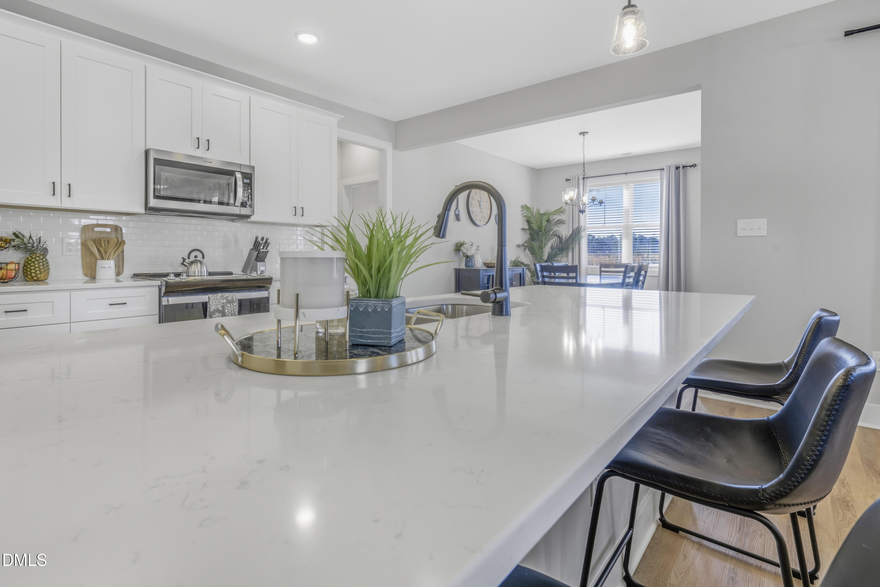 6039 Farmwood Loop Wilson, NC 27896 - Photo 10 of 27 a view of kitchen with dining table and chairs