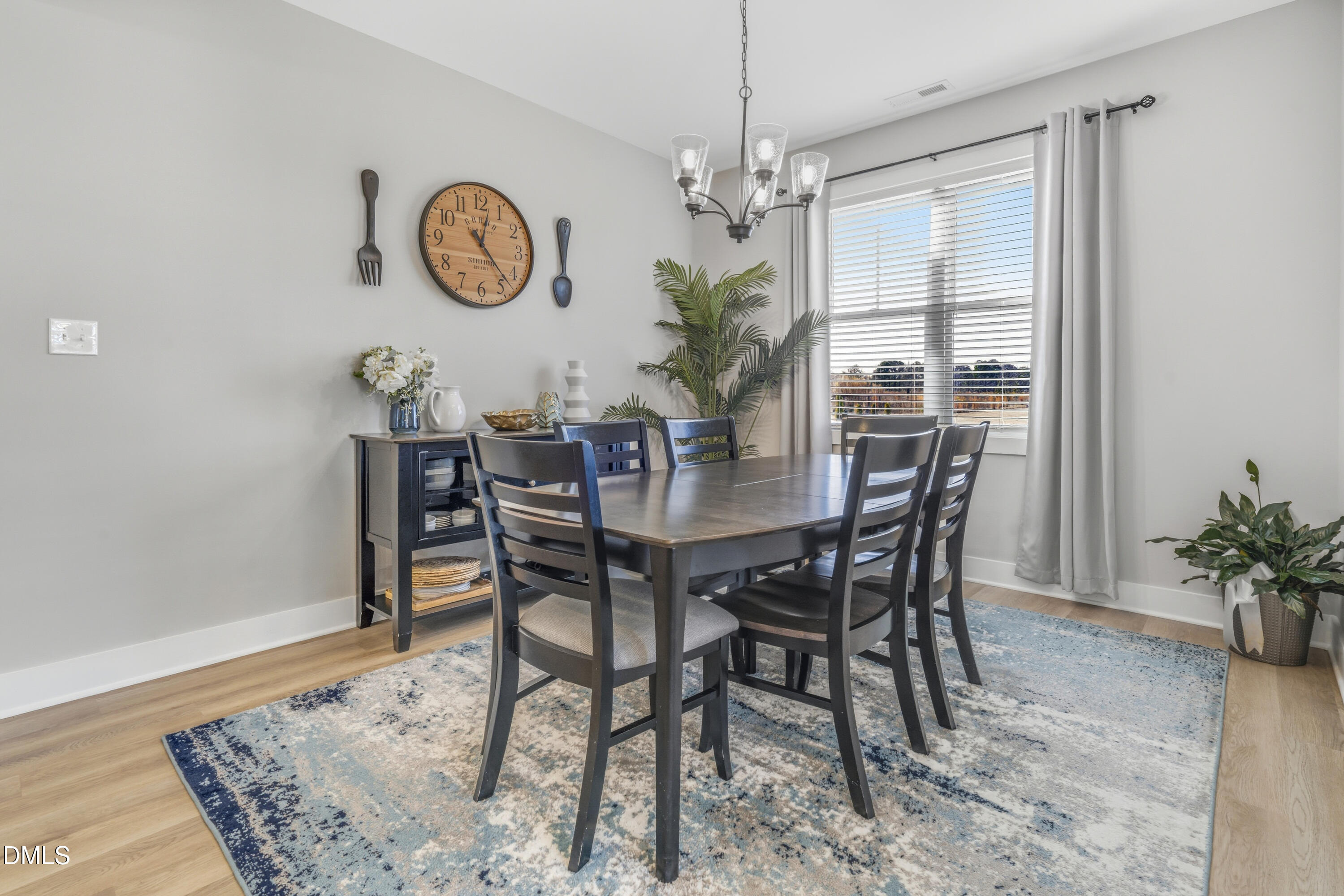 6039 Farmwood Loop Wilson, NC 27896 - Photo 11 of 27 a view of a dining room with furniture and chandelier