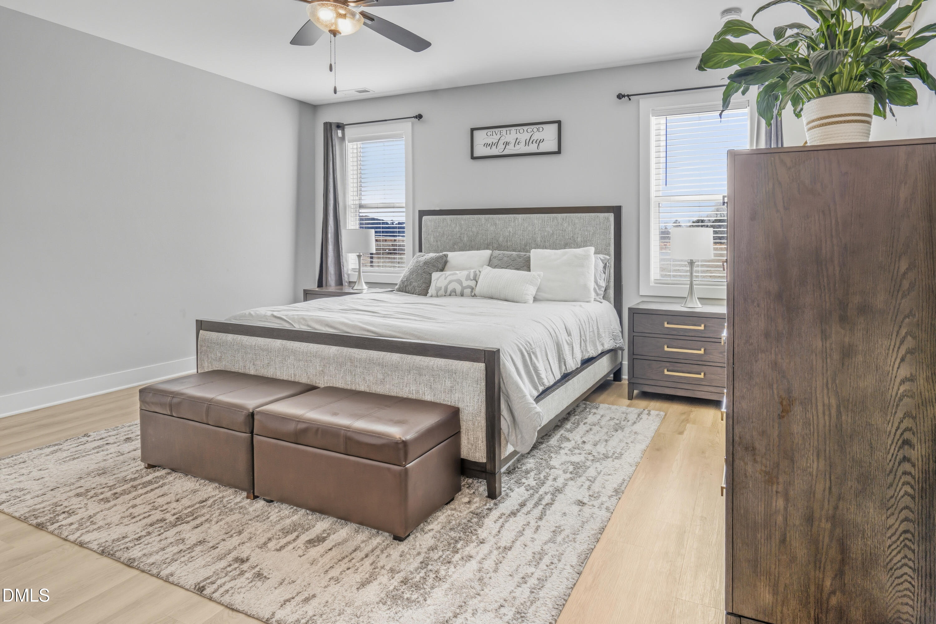 6039 Farmwood Loop Wilson, NC 27896 - Photo 14 of 27 a spacious bedroom with a bed and a chandelier