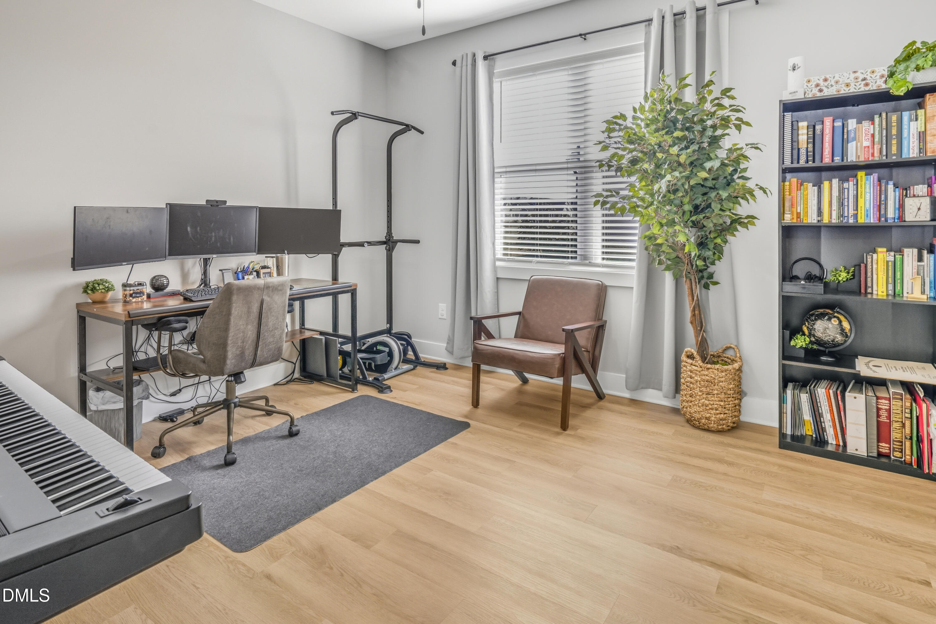 6039 Farmwood Loop Wilson, NC 27896 - Photo 20 of 27 a living room with furniture and a potted plant