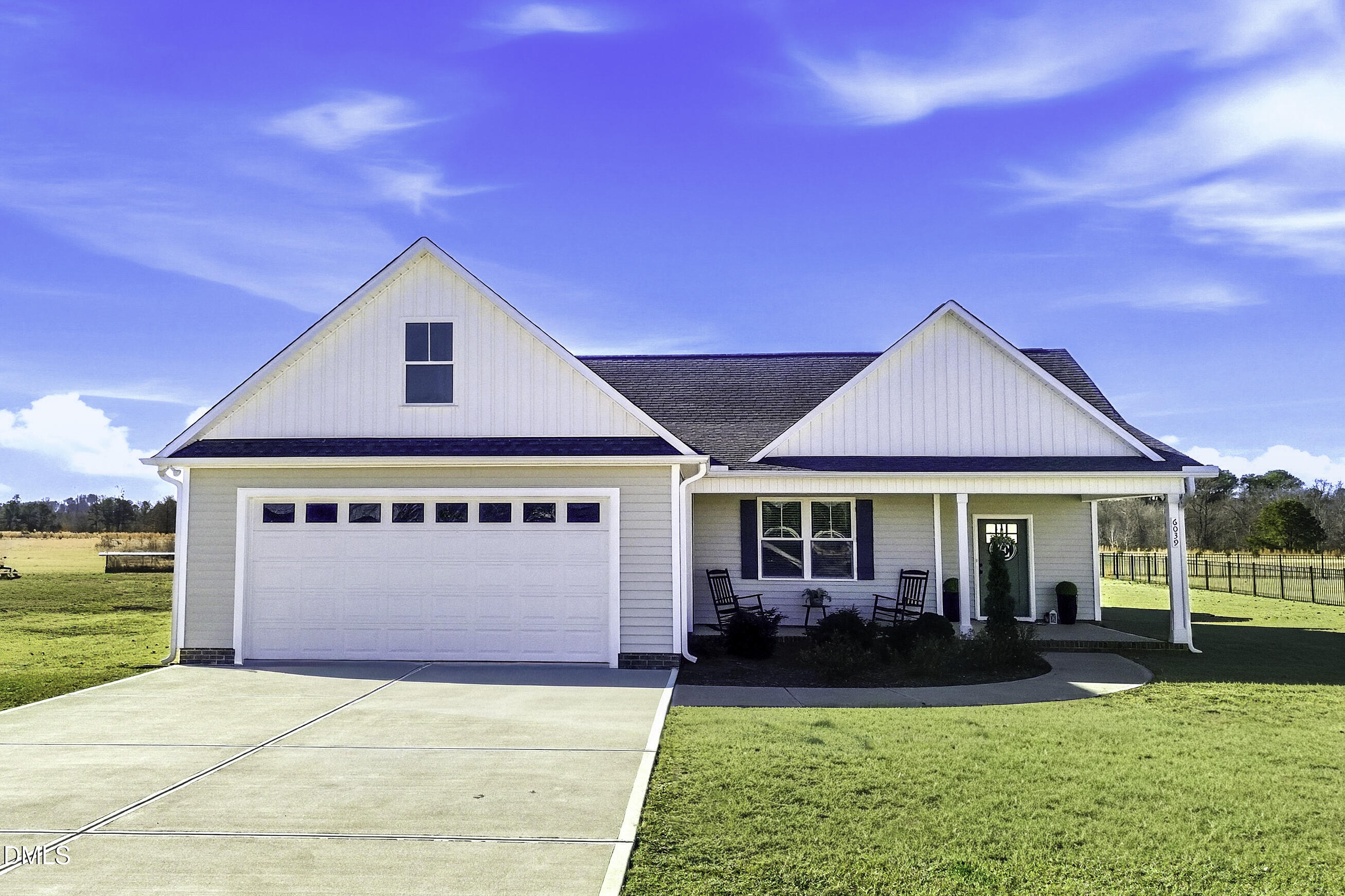 6039 Farmwood Loop Wilson, NC 27896 - Photo 2 of 27 a front view of a house with a yard