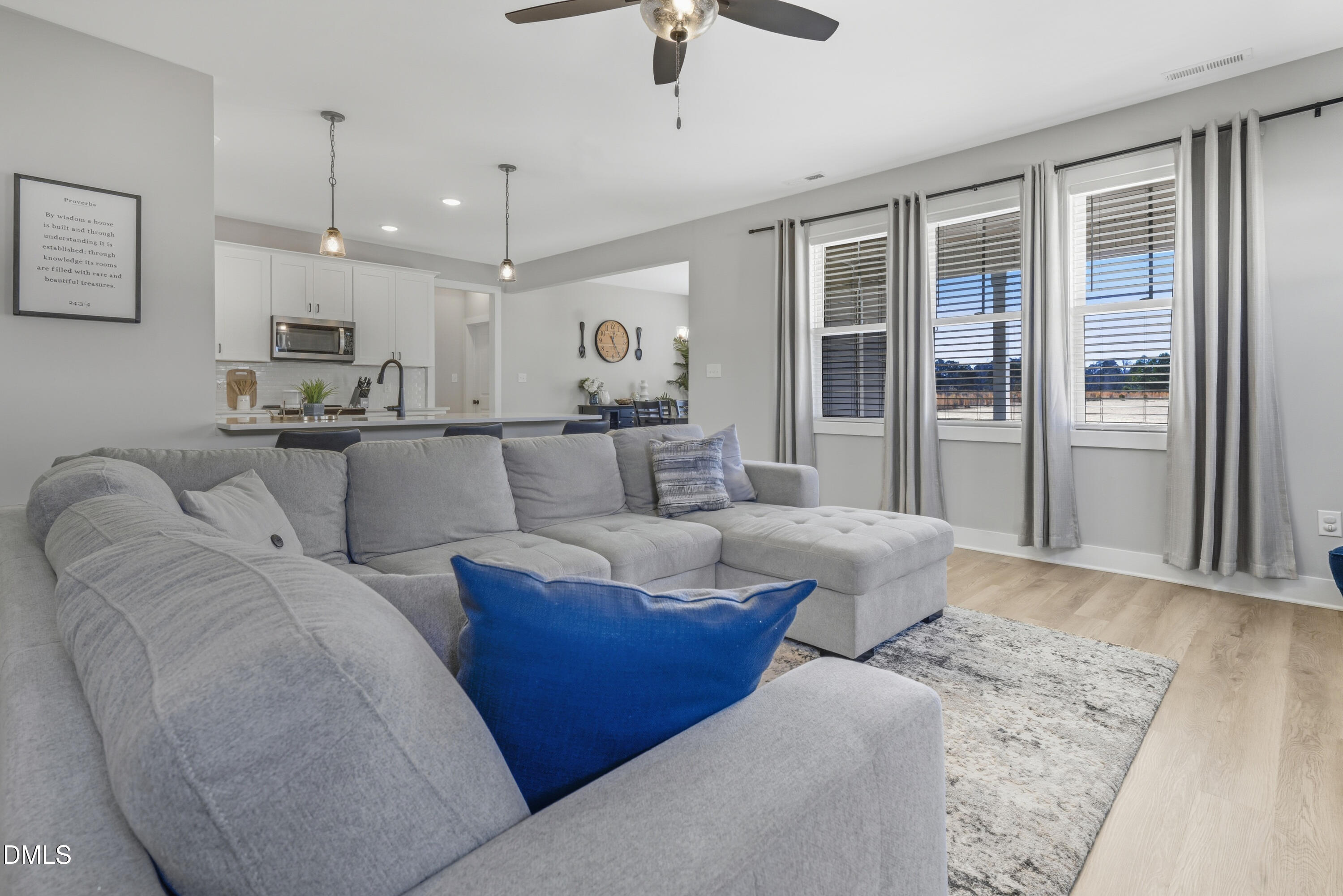 6039 Farmwood Loop Wilson, NC 27896 - Photo 5 of 27 a living room with furniture and a chandelier
