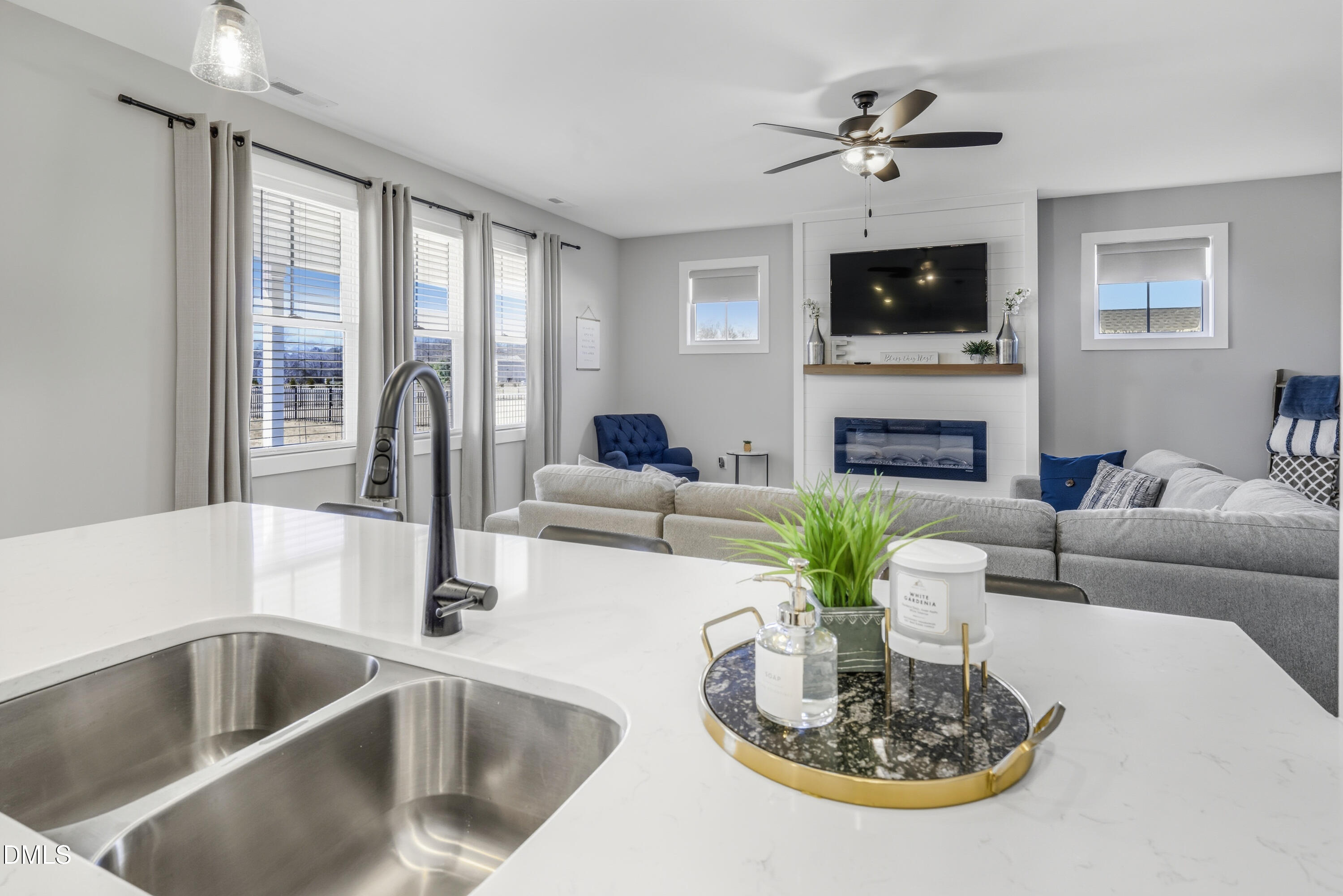 6039 Farmwood Loop Wilson, NC 27896 - Photo 7 of 27 a living room with furniture fireplace and flat screen tv