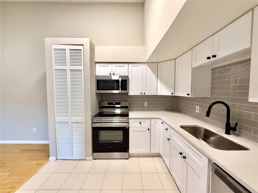 758 Warrenton Road Winter Park, FL 32792 - Photo 12 of 52 a kitchen with a sink cabinets and appliances