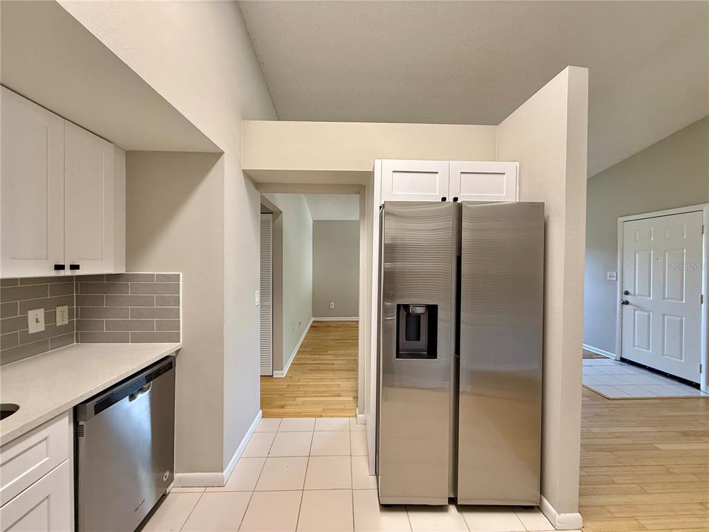 758 Warrenton Road Winter Park, FL 32792 - Photo 14 of 52 a kitchen with stainless steel appliances granite countertop a refrigerator and a sink