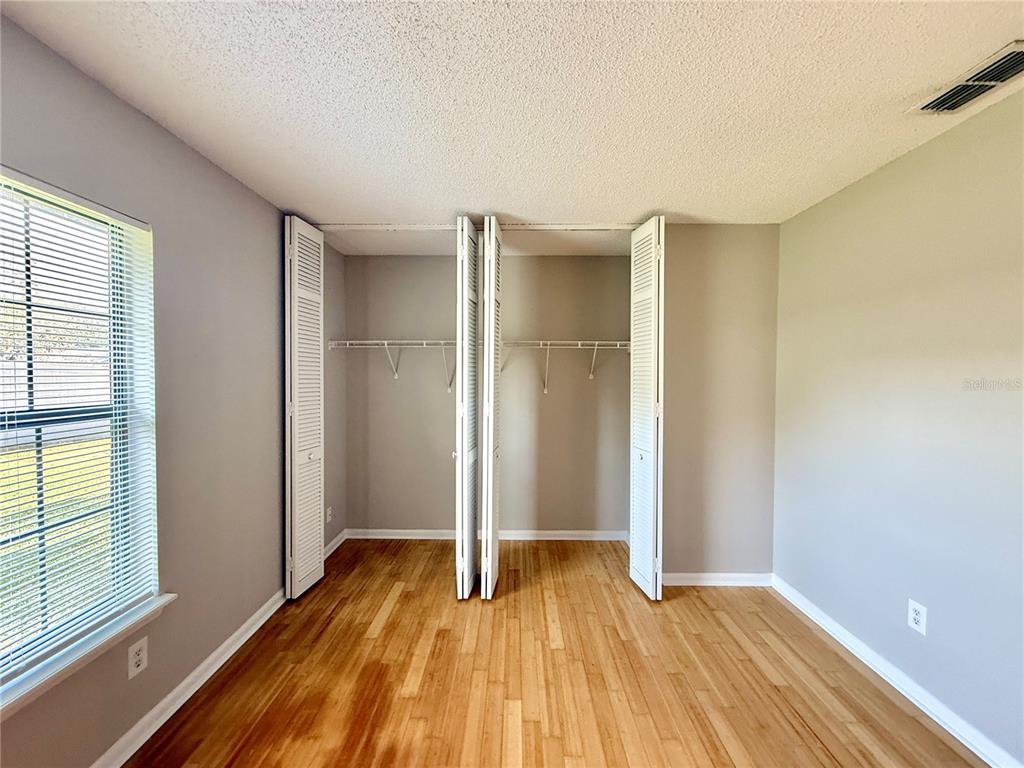 758 Warrenton Road Winter Park, FL 32792 - Photo 20 of 52 a view of an empty room with window and wooden floor