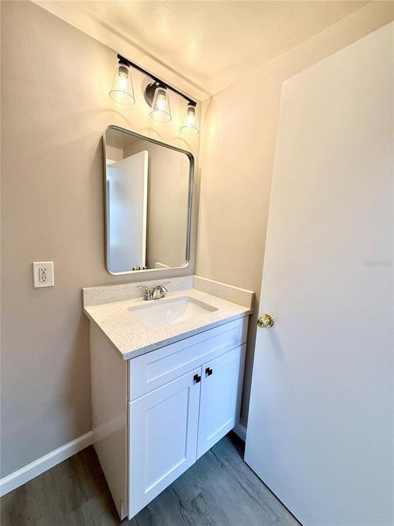 758 Warrenton Road Winter Park, FL 32792 - Photo 23 of 52 a bathroom with a sink and a mirror