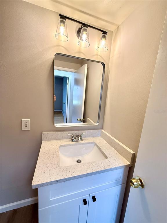 758 Warrenton Road Winter Park, FL 32792 - Photo 24 of 52 a bathroom with a sink and a mirror