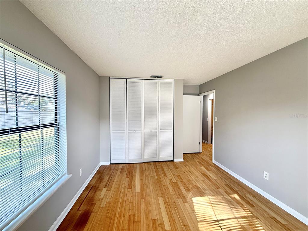 758 Warrenton Road Winter Park, FL 32792 - Photo 26 of 52 a view of empty room with wooden floor and fan