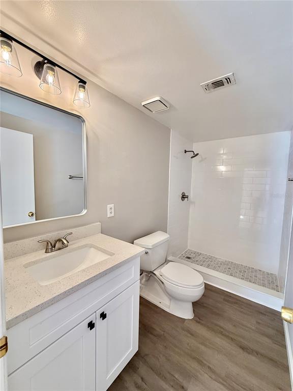 758 Warrenton Road Winter Park, FL 32792 - Photo 33 of 52 a bathroom with a sink a toilet a shower and a mirror