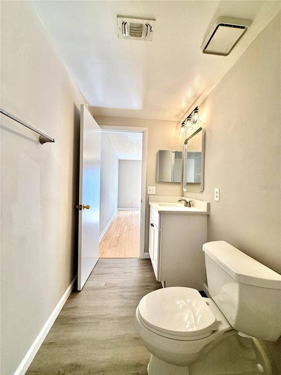 758 Warrenton Road Winter Park, FL 32792 - Photo 36 of 52 a bathroom with a toilet sink and mirror