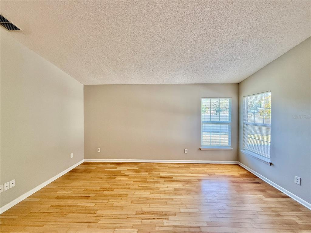 758 Warrenton Road Winter Park, FL 32792 - Photo 5 of 52 wooden floor in an empty room with a window
