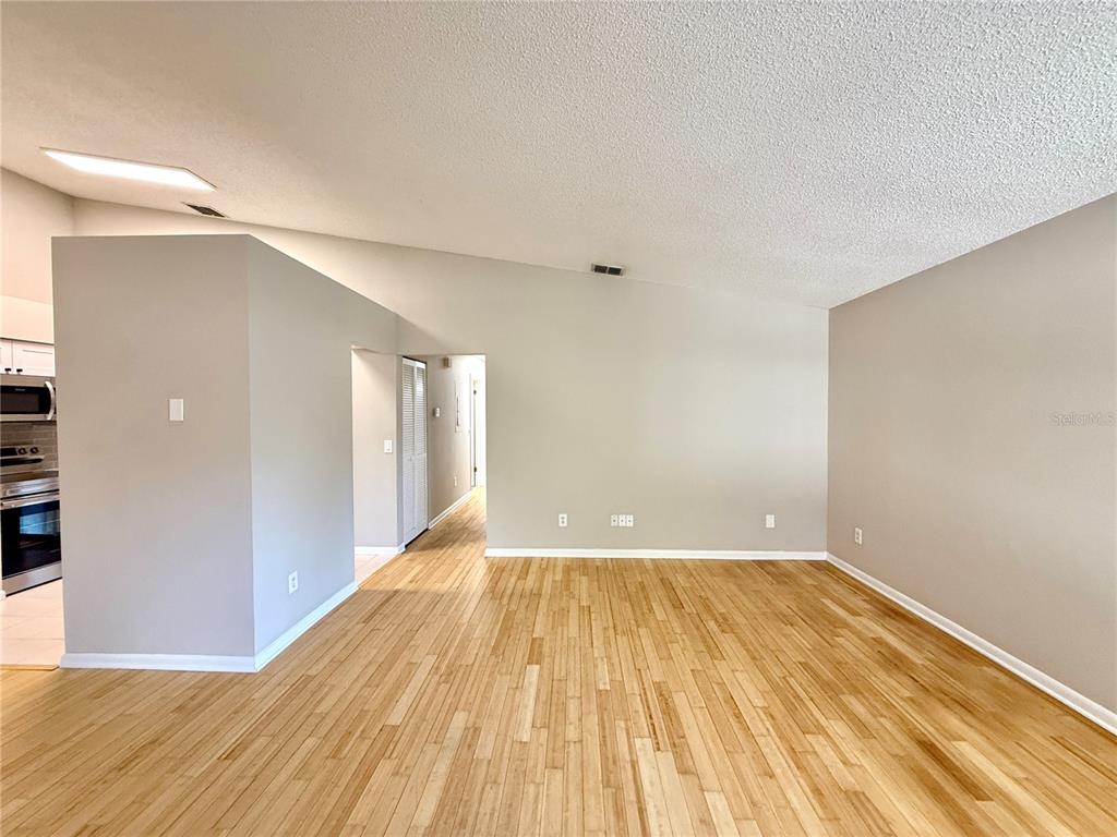 758 Warrenton Road Winter Park, FL 32792 - Photo 6 of 52 a view of a big room with wooden floor and a bathroom