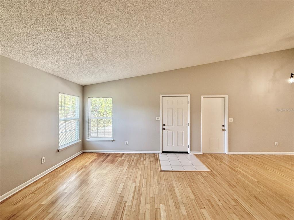 758 Warrenton Road Winter Park, FL 32792 - Photo 7 of 52 wooden floor in an empty room with a window