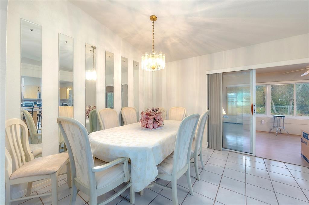 4513 Southwest 158th St Road Ocala, FL 34473 - Photo 12 of 41 a dining room with furniture and window