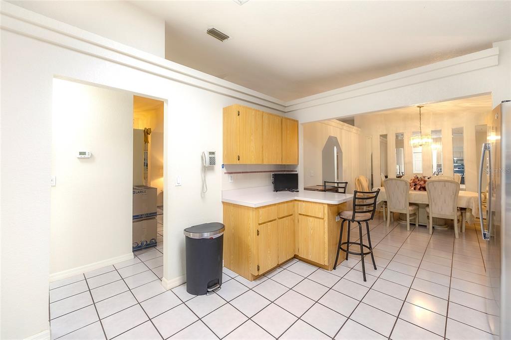 4513 Southwest 158th St Road Ocala, FL 34473 - Photo 18 of 41 a room with a large window and a table