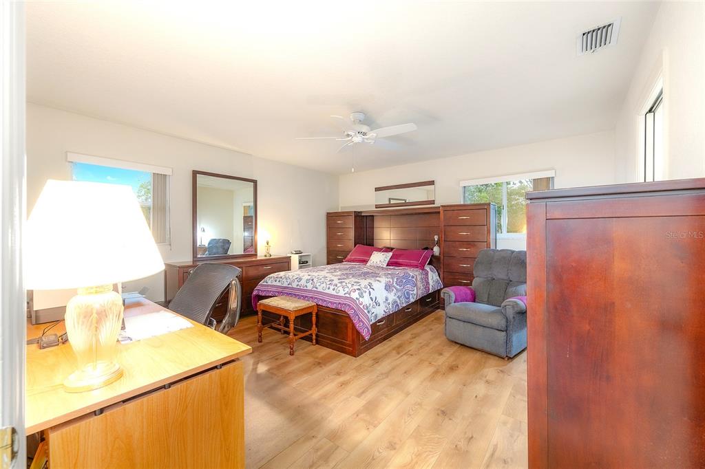 4513 Southwest 158th St Road Ocala, FL 34473 - Photo 19 of 41 a bedroom with a bed and window