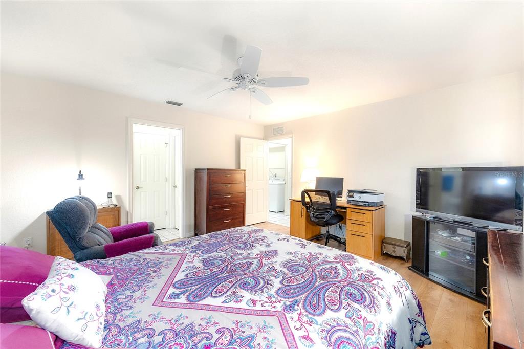 4513 Southwest 158th St Road Ocala, FL 34473 - Photo 20 of 41 a bedroom with a bed and a flat screen tv