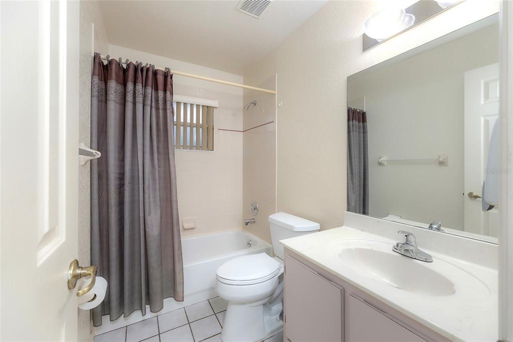 4513 Southwest 158th St Road Ocala, FL 34473 - Photo 25 of 41 a bathroom with a sink toilet and shower