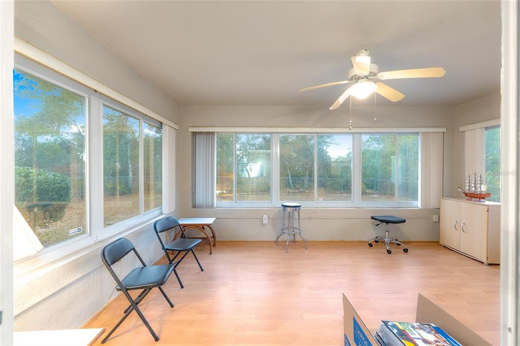 4513 Southwest 158th St Road Ocala, FL 34473 - Photo 28 of 41 a living room with furniture and a large window