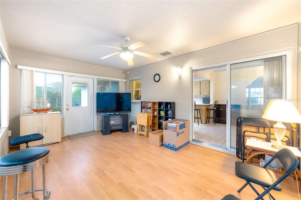 4513 Southwest 158th St Road Ocala, FL 34473 - Photo 29 of 41 a living room with furniture and a flat screen tv