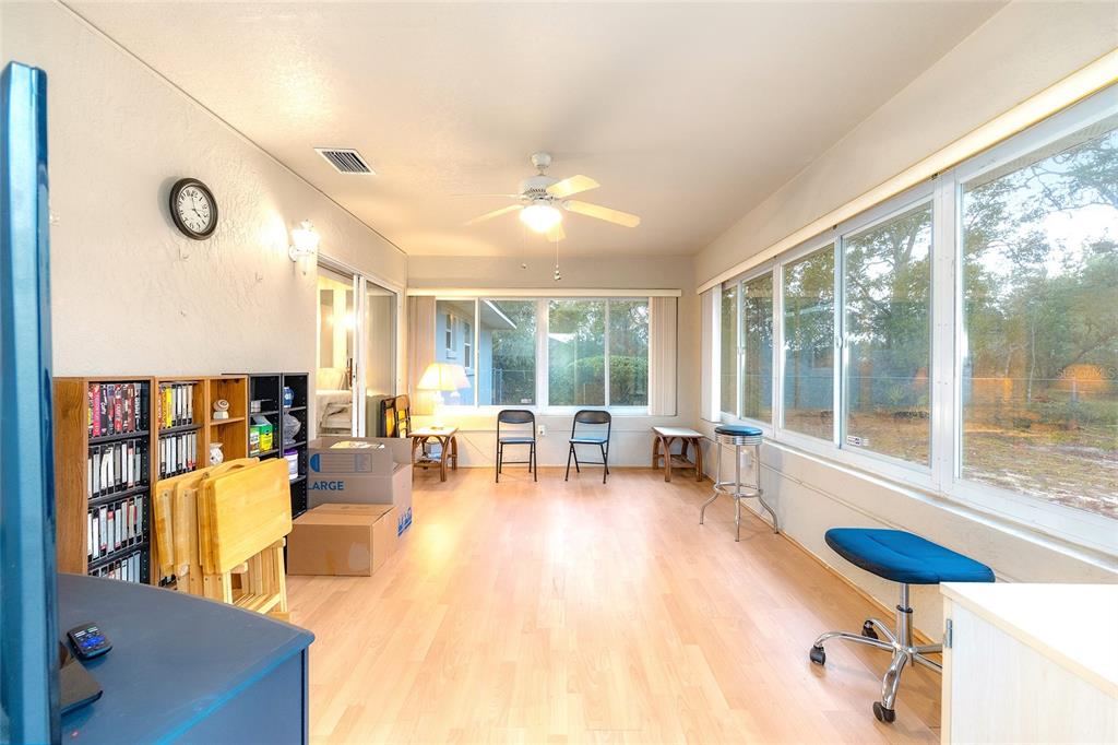 4513 Southwest 158th St Road Ocala, FL 34473 - Photo 30 of 41 a living room with furniture and a large window