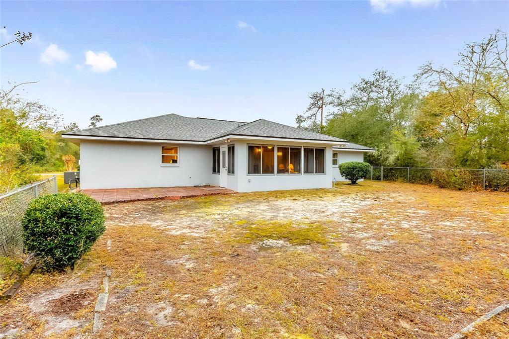 4513 Southwest 158th St Road Ocala, FL 34473 - Photo 32 of 41 a front view of a house with a yard