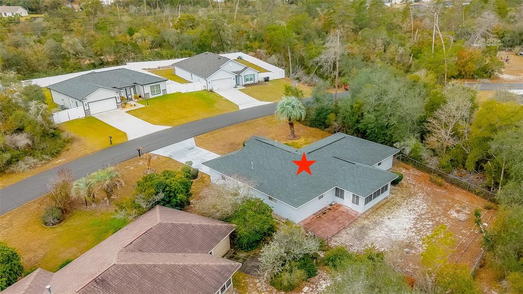 4513 Southwest 158th St Road Ocala, FL 34473 - Photo 38 of 41 an aerial view of a house with a swimming pool