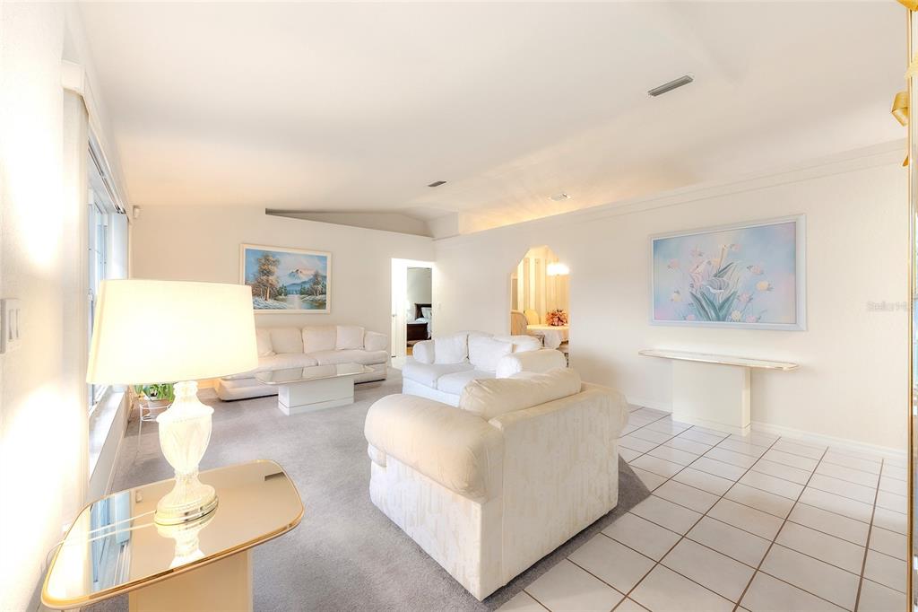 4513 Southwest 158th St Road Ocala, FL 34473 - Photo 6 of 41 a living room with furniture and a painting on the wall