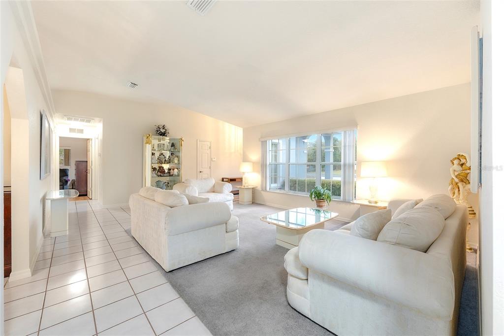4513 Southwest 158th St Road Ocala, FL 34473 - Photo 10 of 41 a living room with furniture and a table