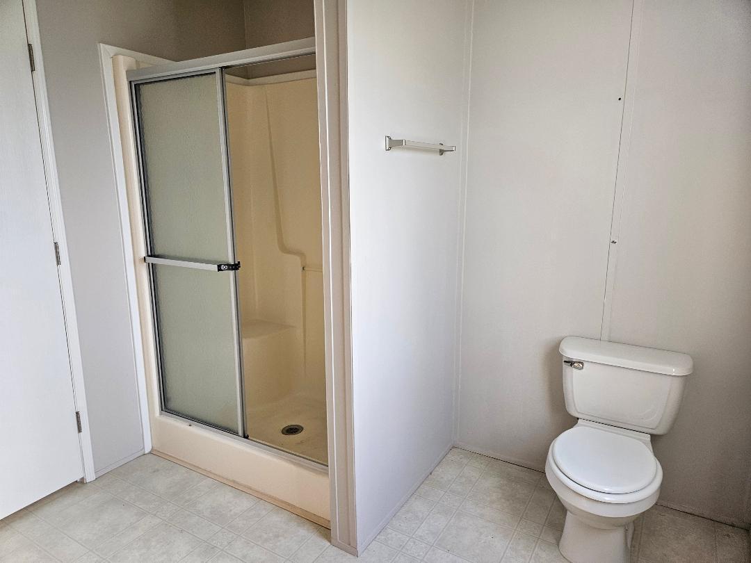 4317 71st Street North, Unit 1277 Riviera Beach, FL 33404 - Photo 15 of 19 a bathroom that has a toilet