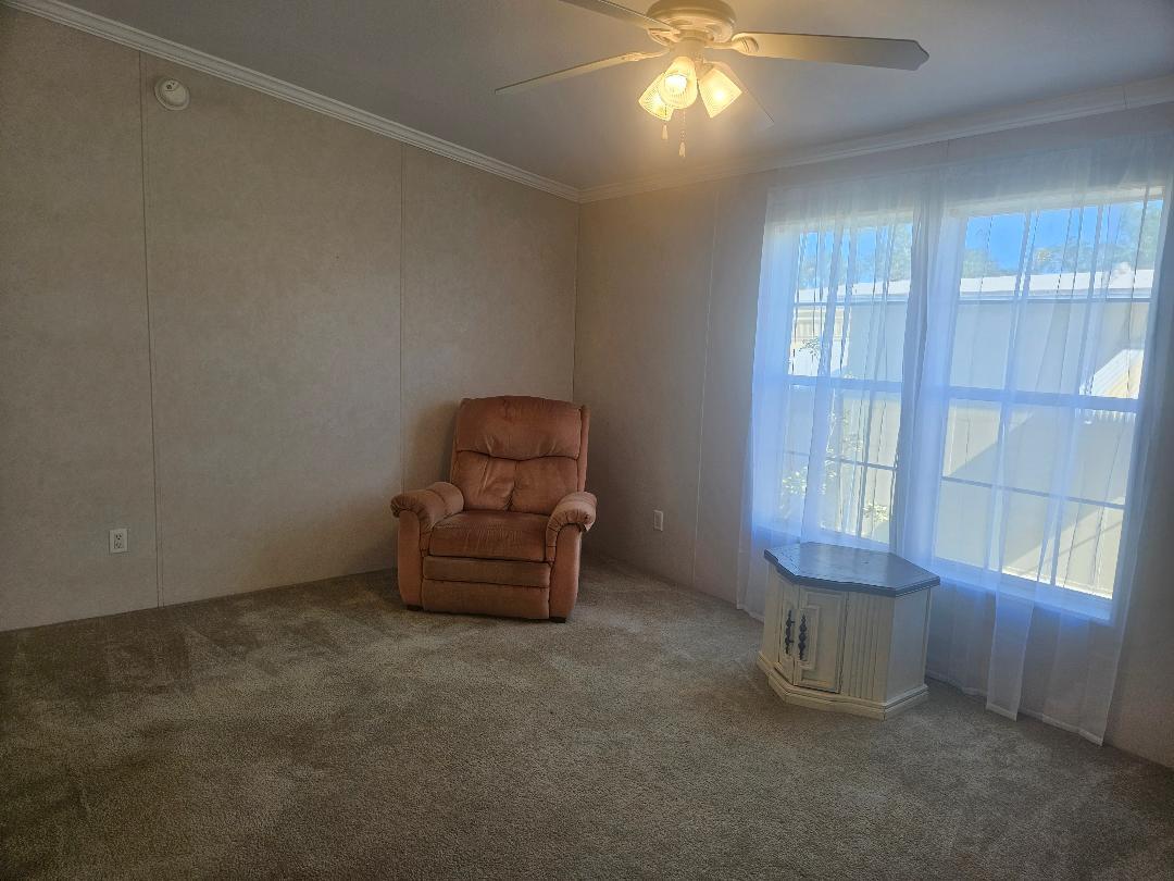 4317 71st Street North, Unit 1277 Riviera Beach, FL 33404 - Photo 9 of 19 an empty room with windows