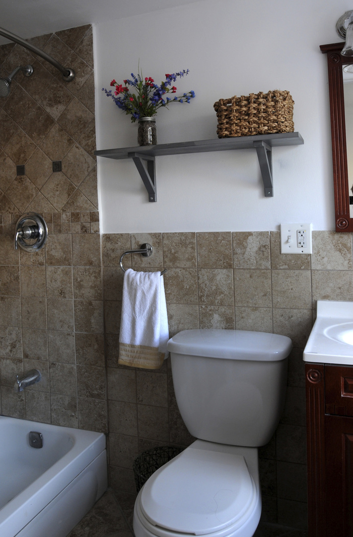 9038 South Forestview Drive North Riverside, IL 60546 - Photo 10 of 24 a bathroom with a toilet sink and shower