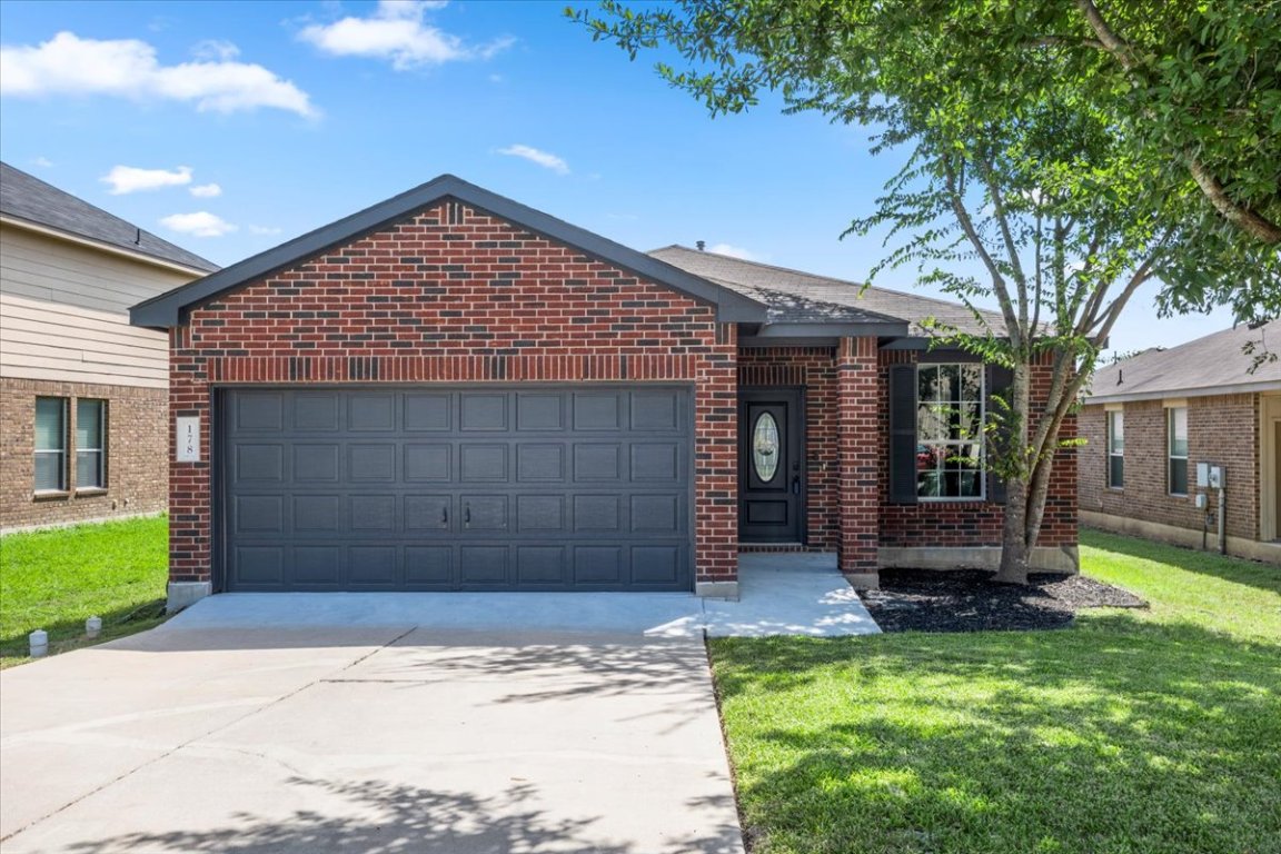 178 Dandy Drive Buda, TX 78610 - Photo 1 of 1 a front view of a house with a yard and garage