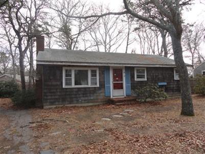 342 Old Craigville Road Centerville, MA 02632 - Photo 1 of 1 a front view of a house with garden