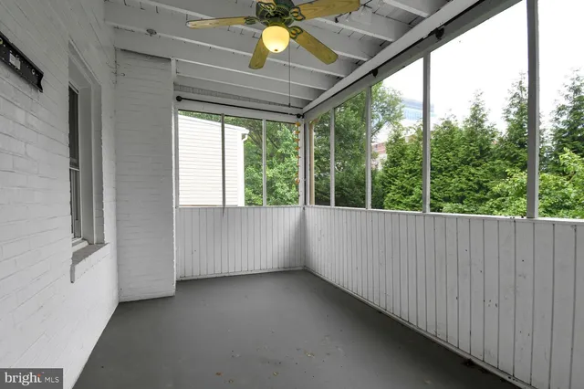 a view of a room with a large window