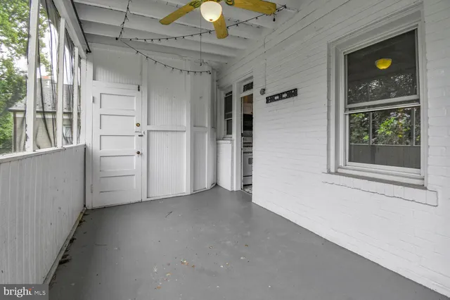 a view of a hallway with a window