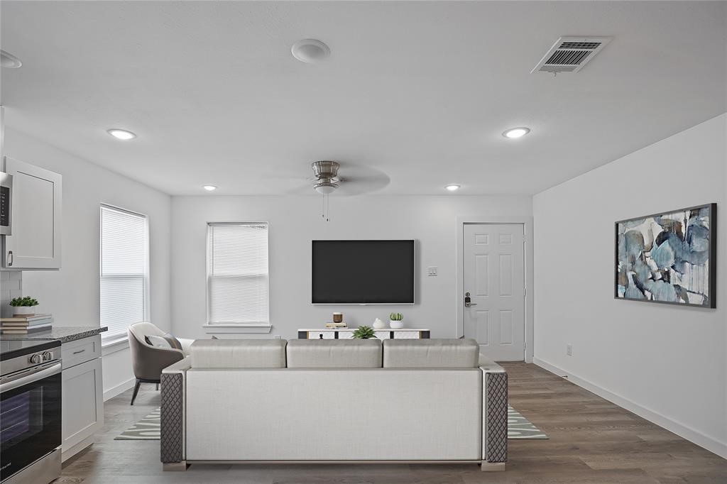 9313 Hillis Street, Unit A Houston, TX 77028 - Photo 1 of 14 a living room with furniture and a flat screen tv