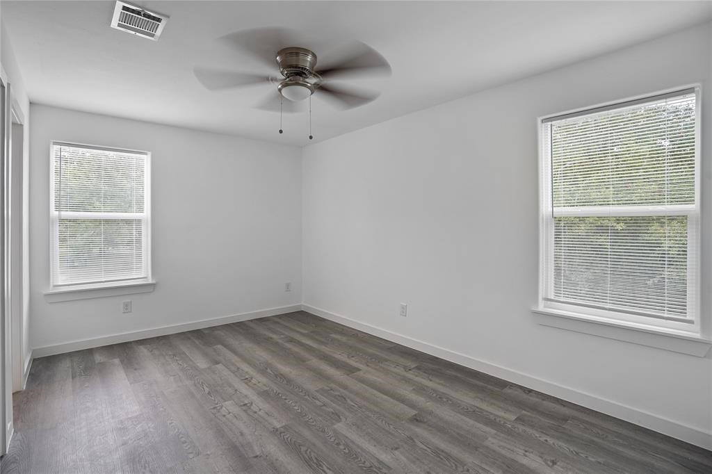 9313 Hillis Street, Unit A Houston, TX 77028 - Photo 12 of 14 an empty room with a window