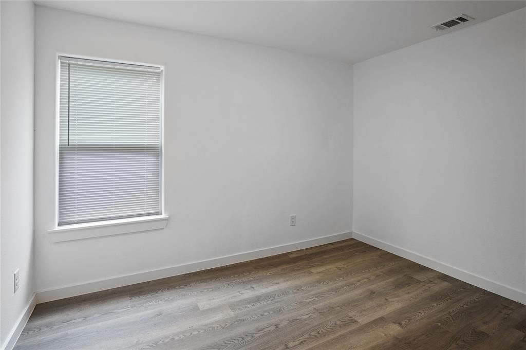 9313 Hillis Street, Unit A Houston, TX 77028 - Photo 13 of 14 an empty room with a window