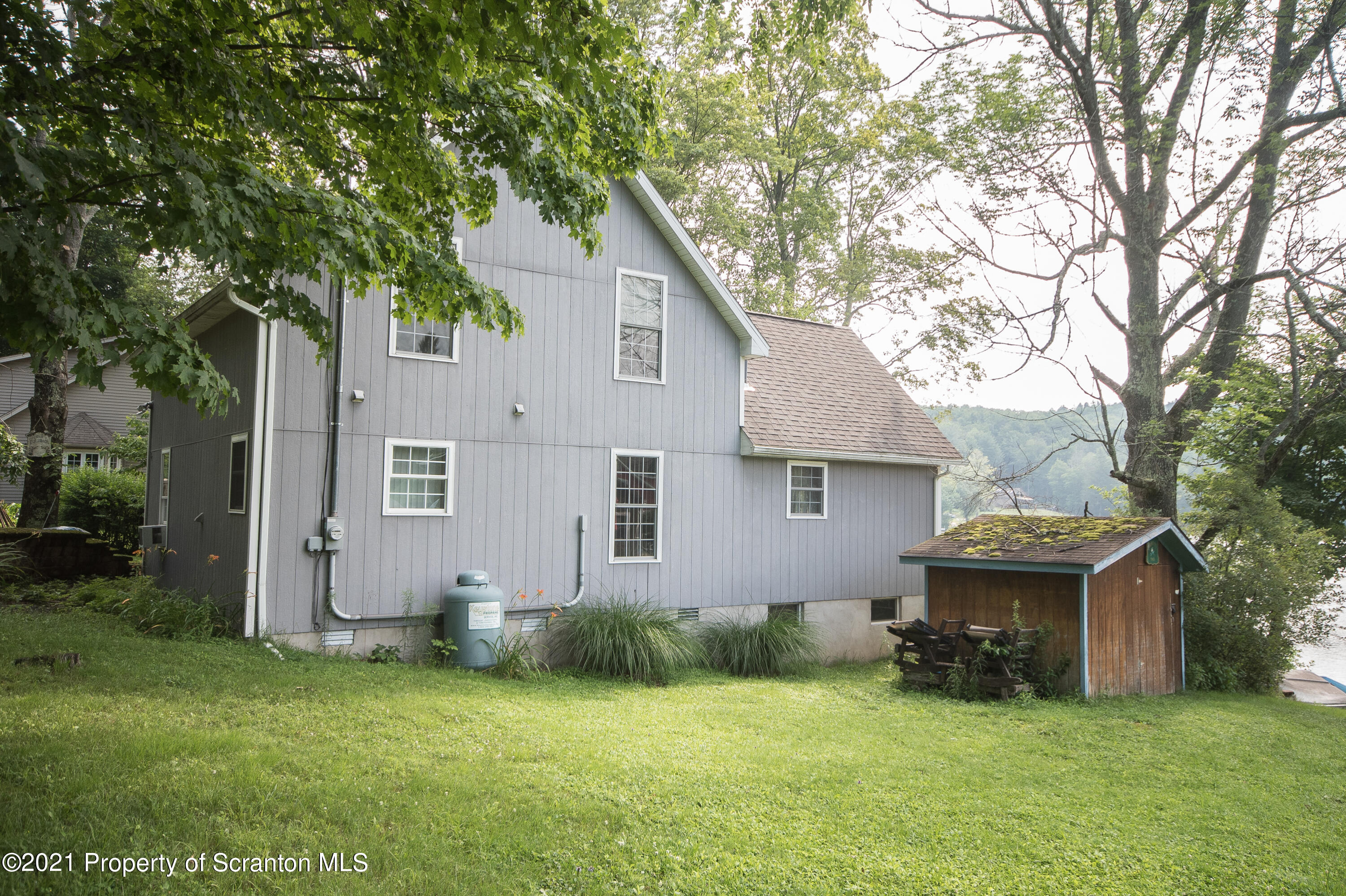 34 Taylor Farm Road Union Dale, PA 18470 - Photo 13 of 38 a front view of a house with a garden and yard